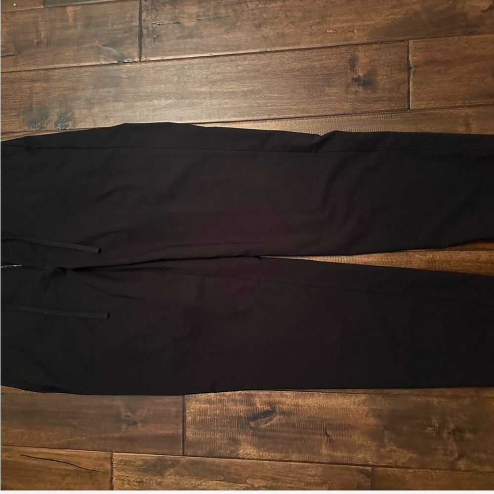 Black slack pants with drawstrings to tighten waist